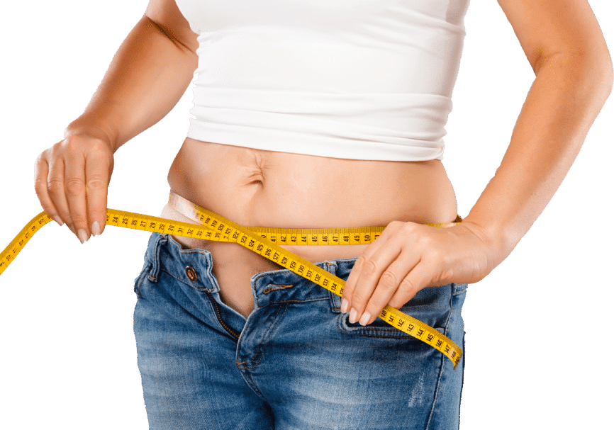 A woman measuring her waist with a tape measure, focusing intently on the measurement for fitness or health purposes.