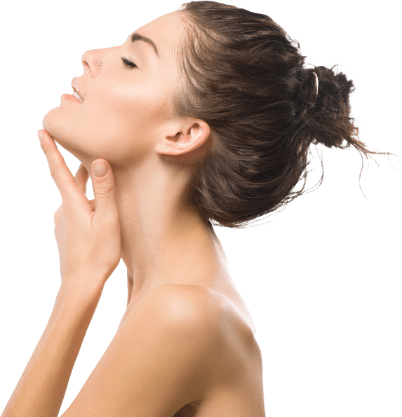 A young woman with a bun is gently touching her neck, showcasing smooth skin against a solid black background.