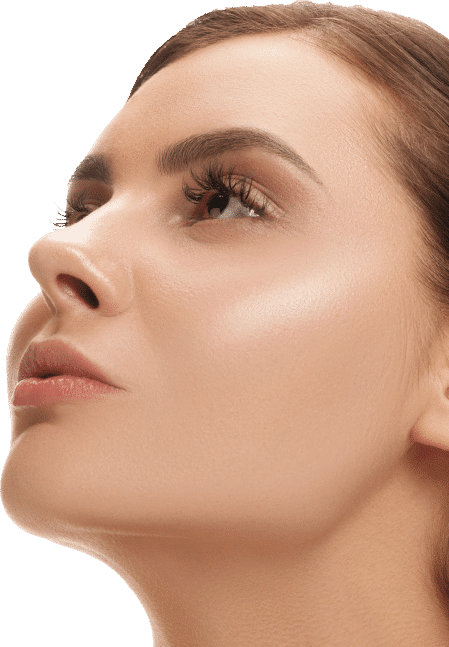 A woman with a fresh, clean face and neck, smiling softly against a neutral background.