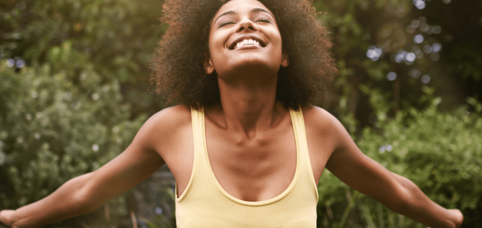 Woman Spreading Her Arms Happily -Harmonia Health Solutions