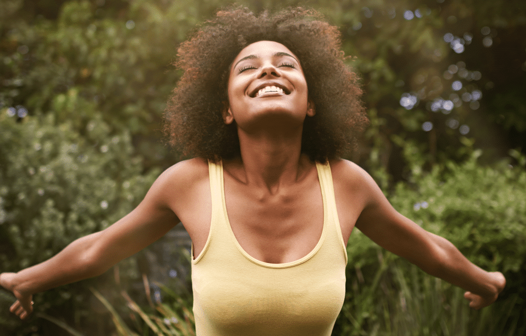 Woman Spreading Her Arms Happily -Harmonia Health Solutions