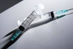 The medical syringes on a white surface