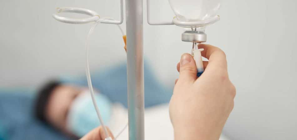 man being treated with IV Therapy