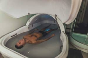 man in a floating therapy machine