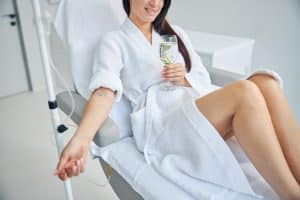 woman relaxing and getting an iv drip